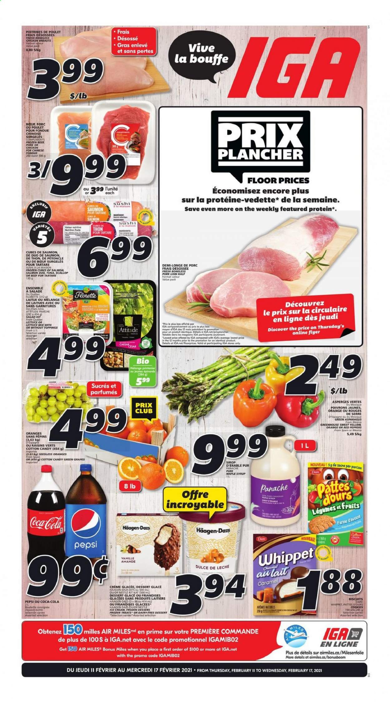 thumbnail - IGA Flyer - February 11, 2021 - February 17, 2021 - Sales products - asparagus, lettuce, salad, peppers, red peppers, grapes, salmon, scallops, ice cream, Häagen-Dazs, cookies, KitKat, cotton candy, biscuit, caramel, maple syrup, syrup, dried fruit, Coca-Cola, Pepsi, chicken breasts, pork loin, pork meat, Nestlé, raisins. Page 1.