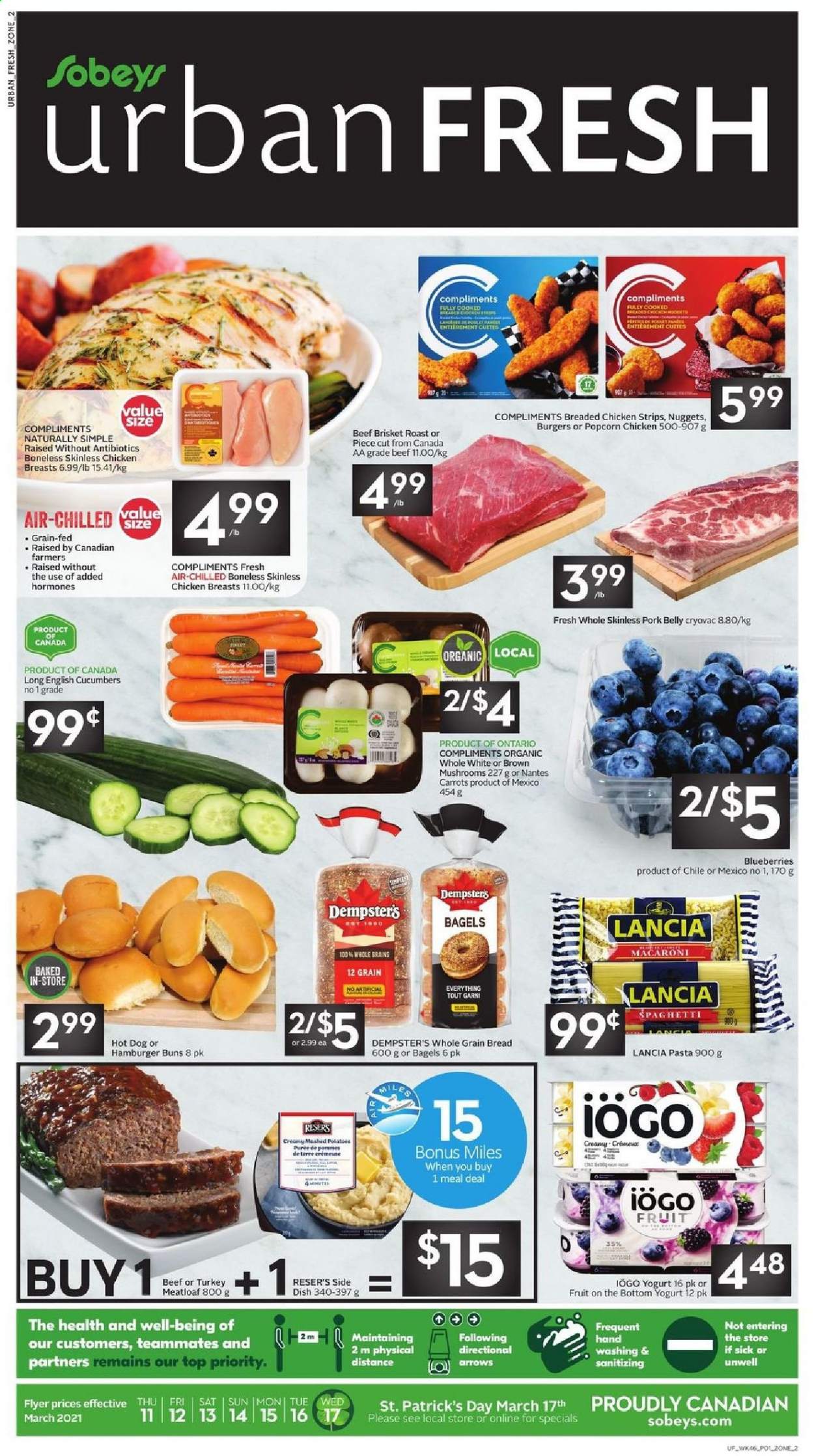 thumbnail - Sobeys Urban Fresh Flyer - March 11, 2021 - March 17, 2021 - Sales products - mushrooms, bagels, bread, buns, burger buns, carrots, cucumber, blueberries, mashed potatoes, spaghetti, hot dog, macaroni, nuggets, pasta, fried chicken, meatloaf, yoghurt, strips, chicken strips, popcorn, beef meat, beef brisket, pork belly, pork meat. Page 1.