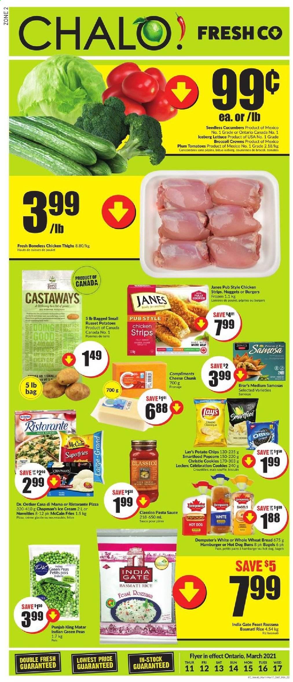 thumbnail - Chalo! FreshCo. Flyer - March 11, 2021 - March 17, 2021 - Sales products - wheat bread, buns, cucumber, russet potatoes, peas, lettuce, pizza, pasta sauce, nuggets, sauce, Dr. Oetker, ice cream, strips, chicken strips, McCain, potato fries, cookies, Celebration, biscuit, potato chips, Lay’s, Smartfood, popcorn, basmati rice, rice, Classico, L'Or, chicken thighs, chicken, Oreo. Page 1.