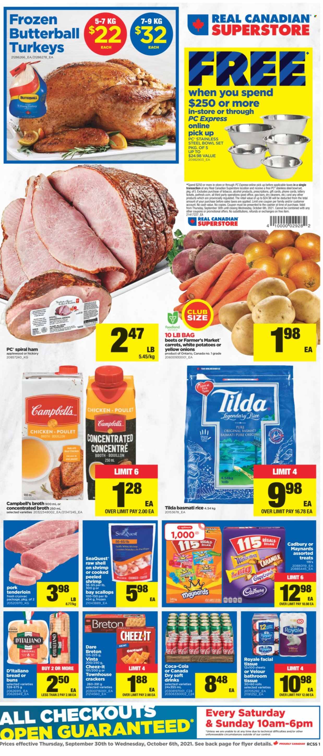 thumbnail - Real Canadian Superstore Flyer - September 30, 2021 - October 06, 2021 - Sales products - bread, buns, potatoes, onion, scallops, shrimps, Campbell's, Butterball, ham, spiral ham, crackers, Cadbury, Cheez-It, bouillon, chicken broth, broth, basmati rice, rice, Canada Dry, Coca-Cola, soft drink, alcohol, pork meat, pork tenderloin, bath tissue, bowl set, bowl. Page 1.