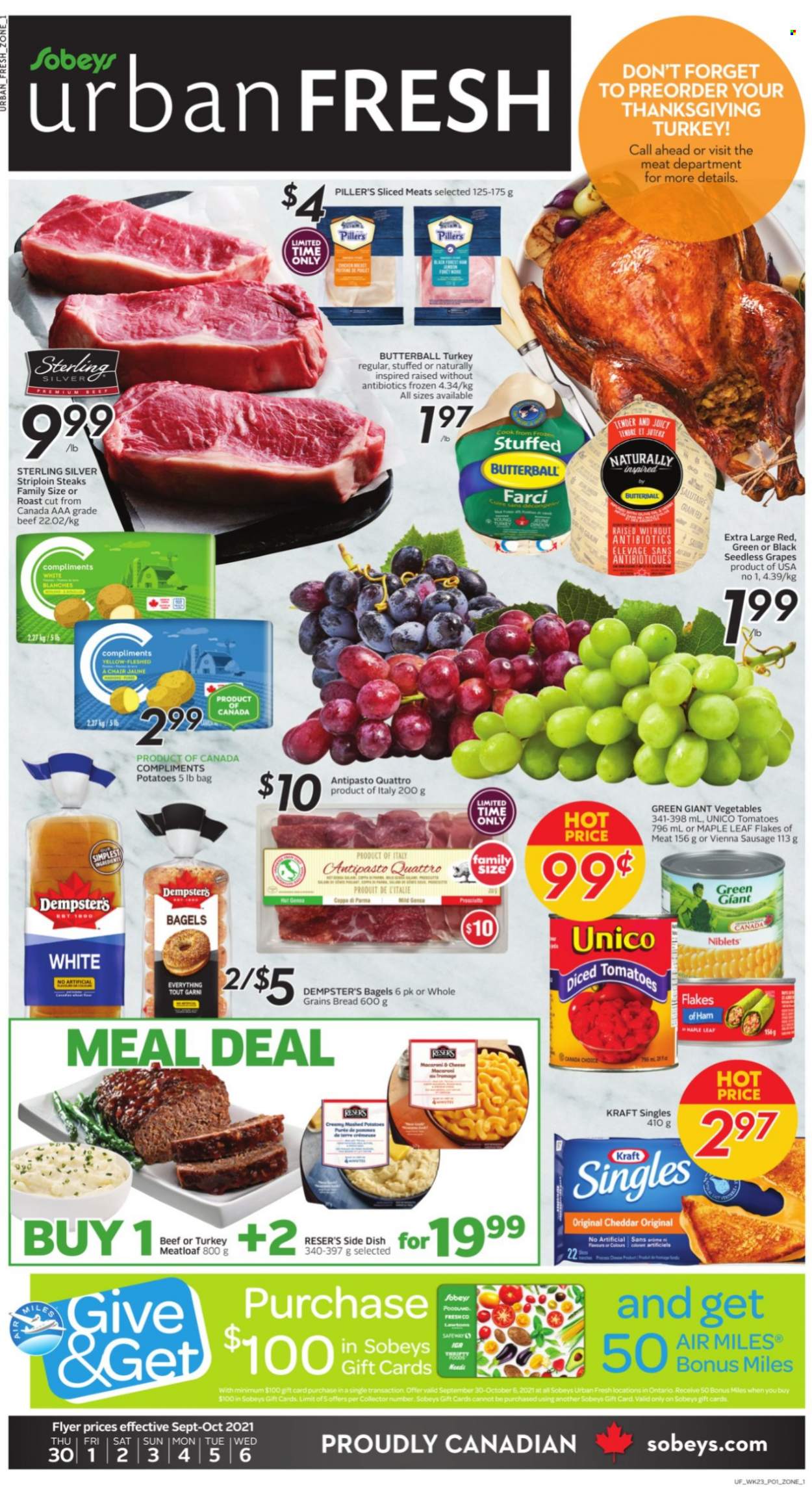 thumbnail - Sobeys Urban Fresh Flyer - September 30, 2021 - October 06, 2021 - Sales products - bagels, bread, tomatoes, potatoes, grapes, seedless grapes, meatloaf, Kraft®, Butterball, ham, sausage, vienna sausage, sandwich slices, cheddar, cheese, Kraft Singles, beef meat, striploin steak, steak. Page 1.