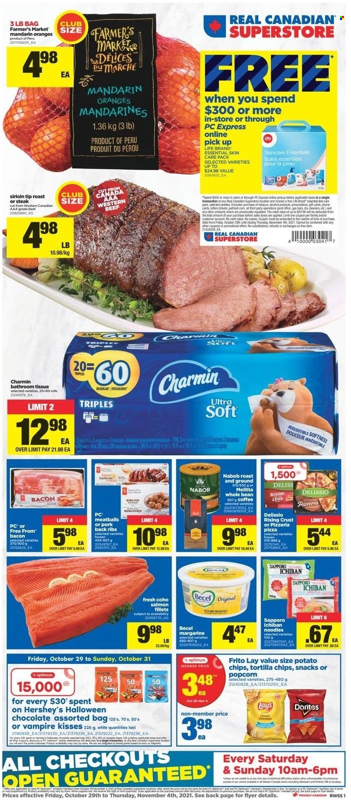 thumbnail - Real Canadian Superstore Flyer - October 29, 2021 - November 04, 2021 - Sales products - mandarines, salmon, salmon fillet, pizza, meatballs, noodles, bacon, margarine, Hershey's, chocolate, snack, Doritos, tortilla chips, potato chips, Lay’s, popcorn, coffee, pork meat, pork ribs, pork back ribs, bath tissue, Charmin, Optimum, phone, Halloween, steak, oranges. Page 1.