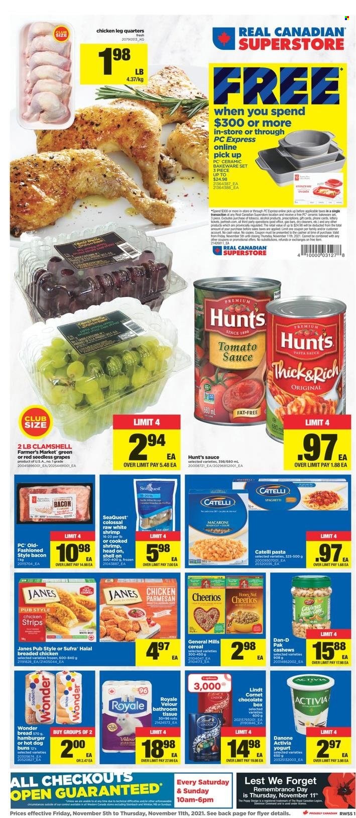 thumbnail - Real Canadian Superstore Flyer - November 05, 2021 - November 11, 2021 - Sales products - bread, buns, Ace, grapes, seedless grapes, shrimps, pasta sauce, macaroni, sauce, fried chicken, bacon, yoghurt, Activia, strips, chicken strips, chocolate, tomato sauce, cereals, Cheerios, Dan-D Pak, cashews, alcohol, chicken legs, tissues, bakeware, Danone, Lindt. Page 1.