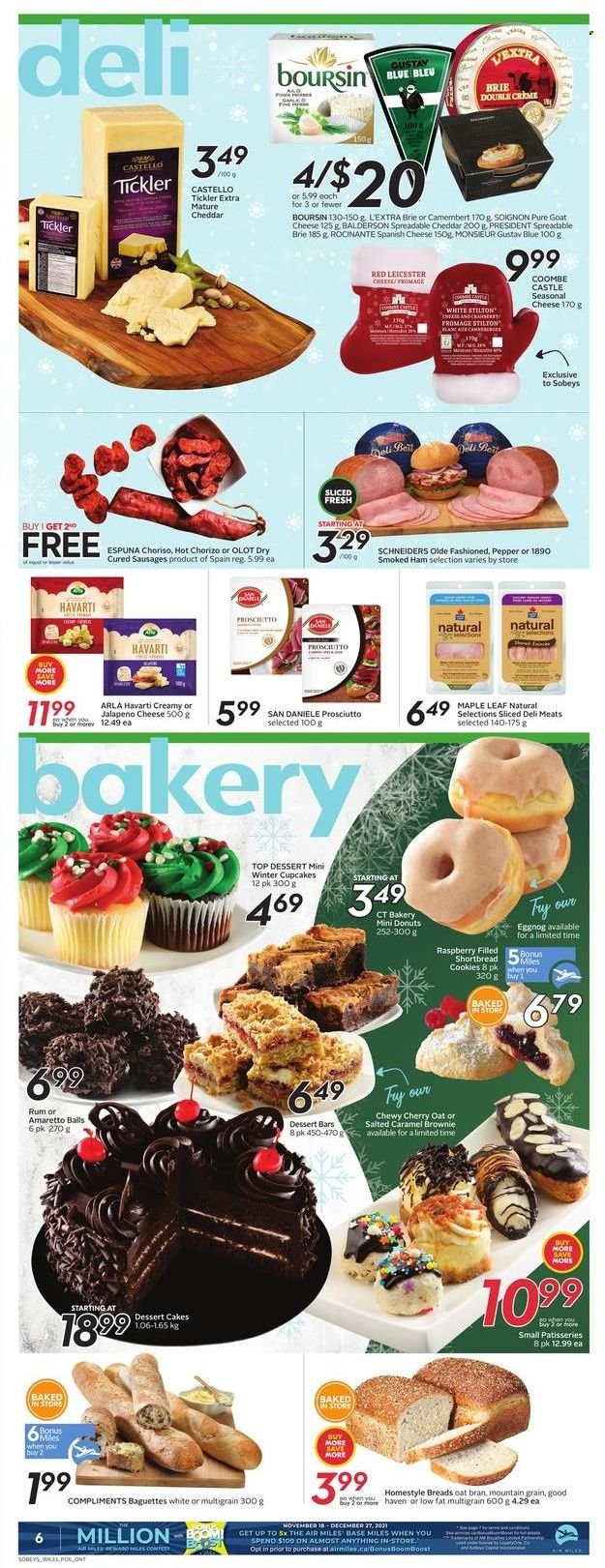 thumbnail - Sobeys Flyer - December 09, 2021 - December 15, 2021 - Sales products - cake, cupcake, brownies, donut, cherries, ham, prosciutto, smoked ham, sausage, goat cheese, Red Leicester, Stilton, Havarti, cheddar, cheese, brie, Président, Arla, cookies, pepper, Amaretto, eggnog, rum, Castle, baguette, camembert, chorizo. Page 5.