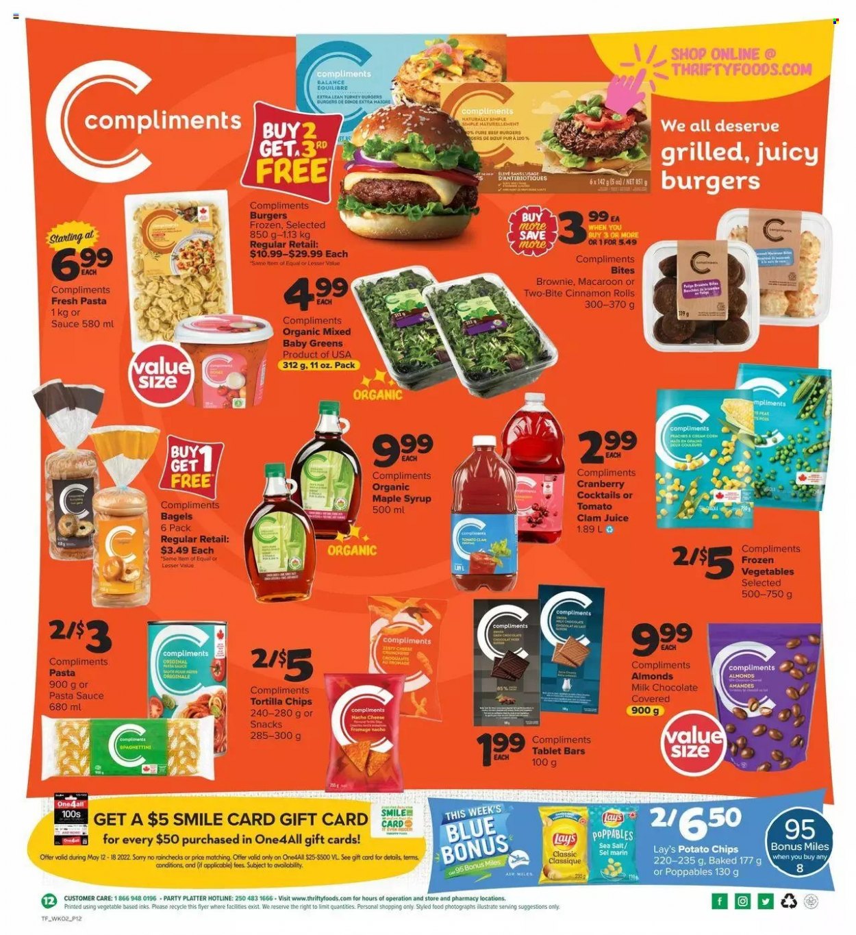 thumbnail - Thrifty Foods Flyer - May 12, 2022 - May 18, 2022 - Sales products - bagels, cinnamon roll, brownies, clams, pasta sauce, hamburger, sauce, cheese, frozen vegetables, milk chocolate, snack, tortilla chips, potato chips, Lay’s, maple syrup, syrup, almonds, juice, turkey burger. Page 12.