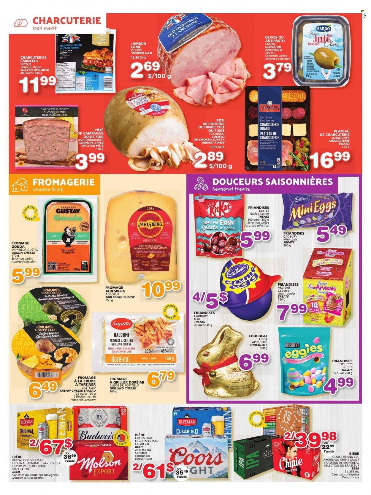 thumbnail - IGA Flyer - March 16, 2023 - March 22, 2023 - Sales products - roast, ham, smoked ham, cheese spread, cream cheese, gouda, Hershey's, chocolate, KitKat, Cadbury, herbs, beer, IPA, Budweiser, Nestlé, olives, Lindt, Coors. Page 5.