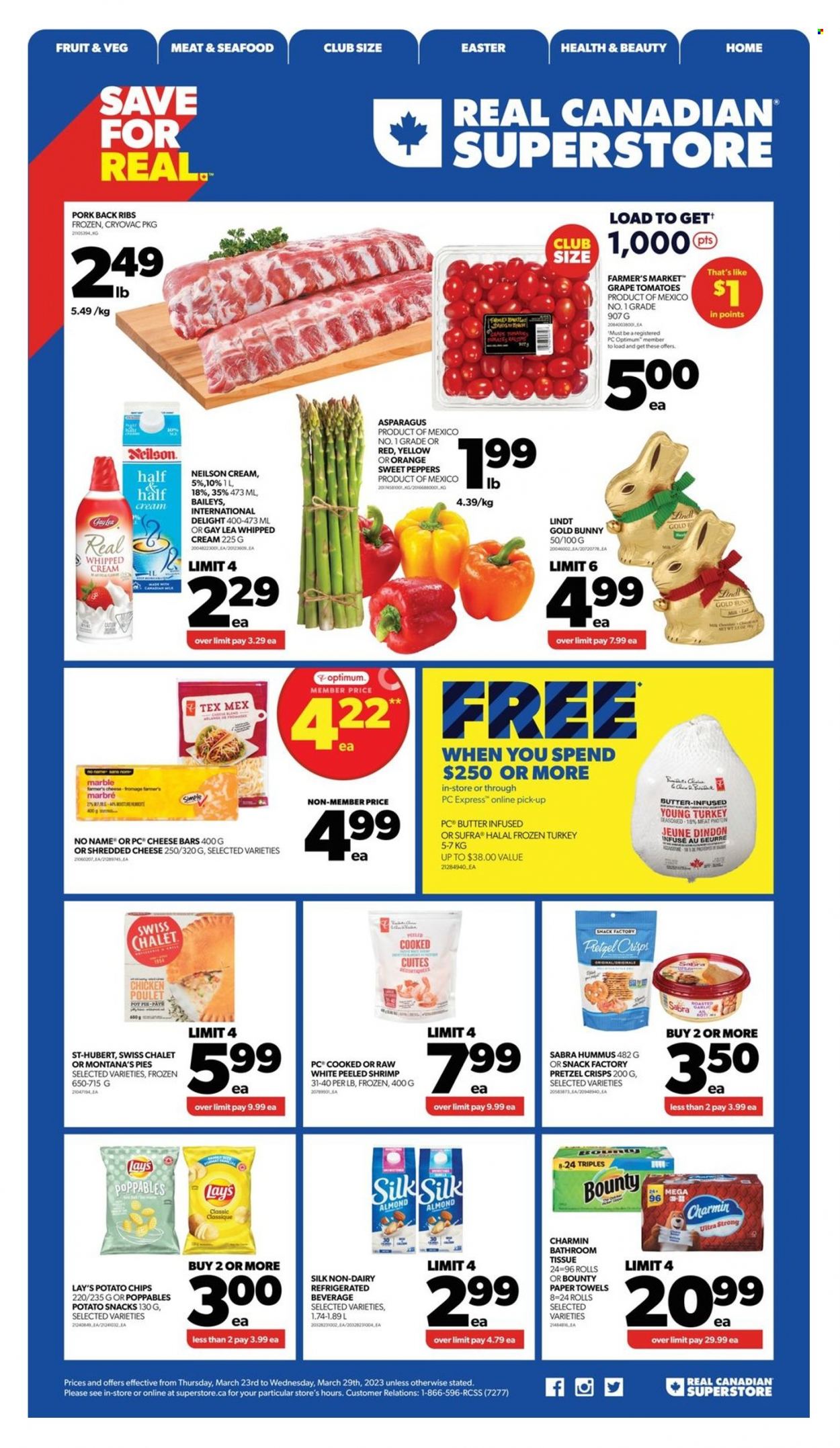 thumbnail - Real Canadian Superstore Flyer - March 23, 2023 - March 29, 2023 - Sales products - pie, pot pie, asparagus, sweet peppers, tomatoes, peppers, oranges, No Name, hummus, shredded cheese, butter, whipped cream, Bounty, potato chips, Lay’s, pretzel crisps, Baileys, dried fruit, whole turkey, chicken, turkey, ribs, pork meat, pork ribs, pork back ribs, bath tissue, kitchen towels, paper towels, Charmin, pot, Optimum, raisins, Lindt. Page 1.