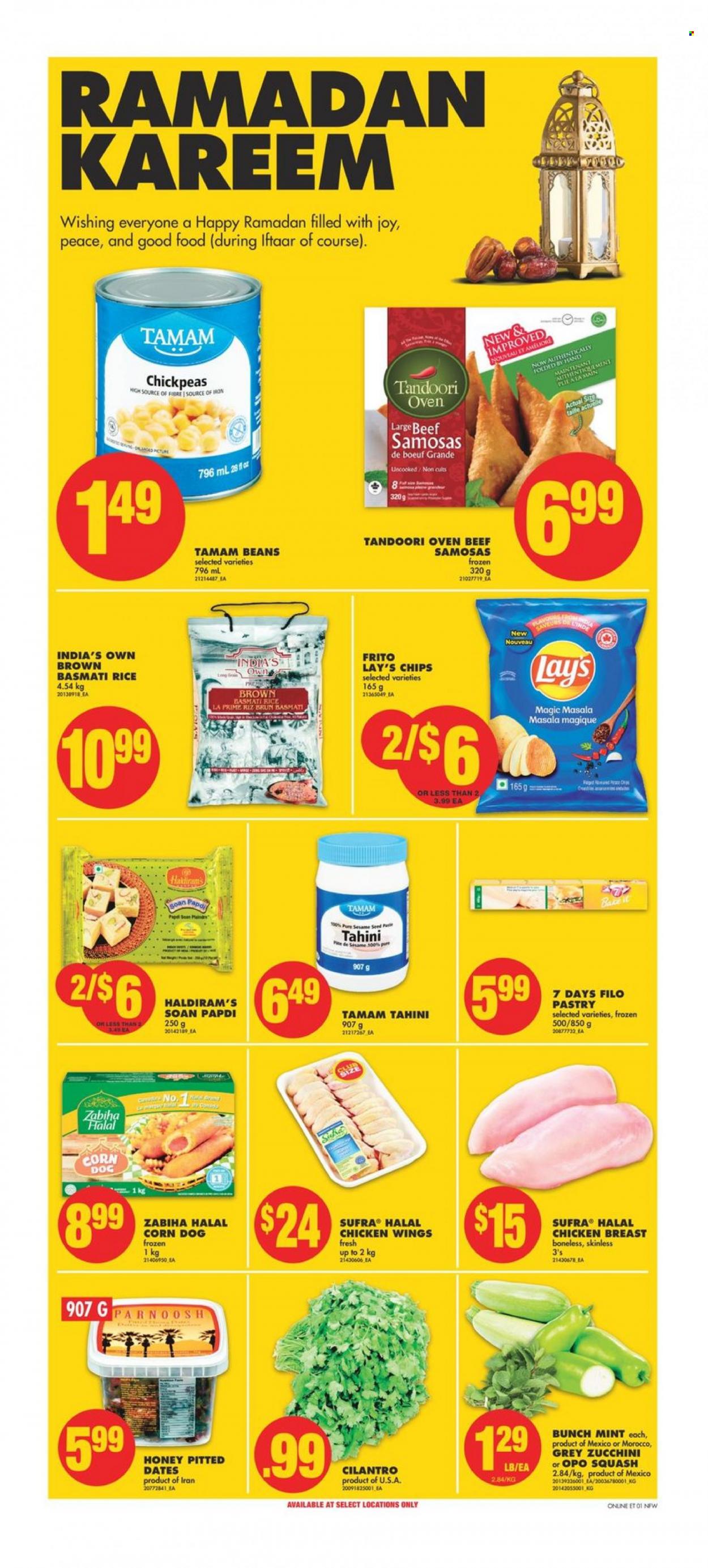 thumbnail - No Frills Flyer - March 30, 2023 - April 05, 2023 - Sales products - beans, corn, zucchini, filo dough, chicken wings, 7 Days, Lay’s, sesame seed, basmati rice, rice, chickpeas, cilantro, tahini, honey, dried fruit, dried dates, chicken breasts, chicken, Joy. Page 1.