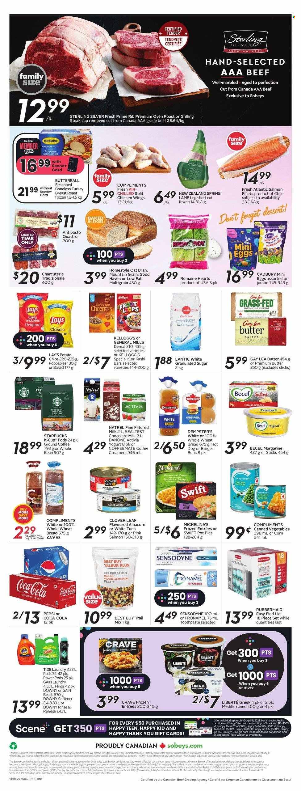 thumbnail - Sobeys Flyer - March 30, 2023 - April 05, 2023 - Sales products - wheat bread, buns, burger buns, pot pie, corn, salmon, salmon fillet, tuna, hot dog, turkey roast, roast, Butterball, yoghurt, Clover, Activia, milk, margarine, chicken wings, milk chocolate, Celebration, Kellogg's, Cadbury, chocolate egg, potato chips, Lay’s, granulated sugar, sugar, oats, canned vegetables, cereals, trail mix, Coca-Cola, Pepsi, coffee, ground coffee, coffee capsules, Starbucks, McCafe, K-Cups, Keurig, turkey breast, chicken, turkey, steak, lamb meat, lamb leg, Gain, Tide, fabric softener, Downy Laundry, toothpaste, Danone, Sensodyne. Page 2.