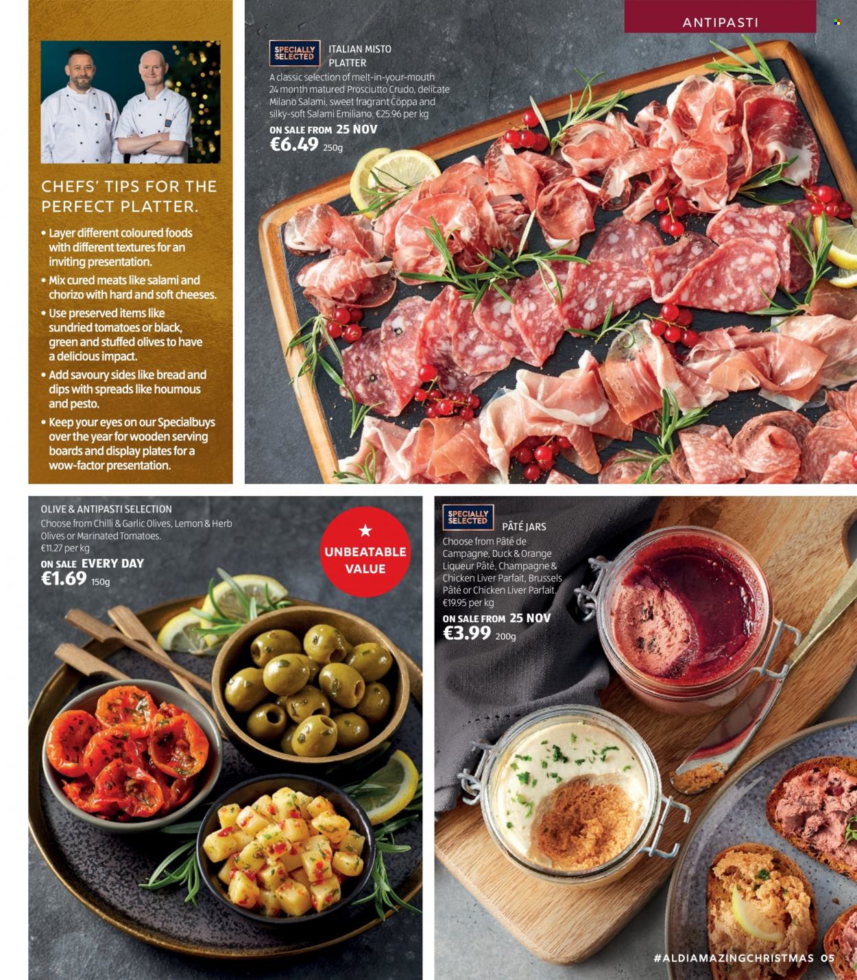 thumbnail - Aldi offer  - Sales products - bread, tomatoes, salami, prosciutto, chorizo, houmous, cheese, dried tomatoes, olives, pesto, liqueur, plate, jar. Page 5.