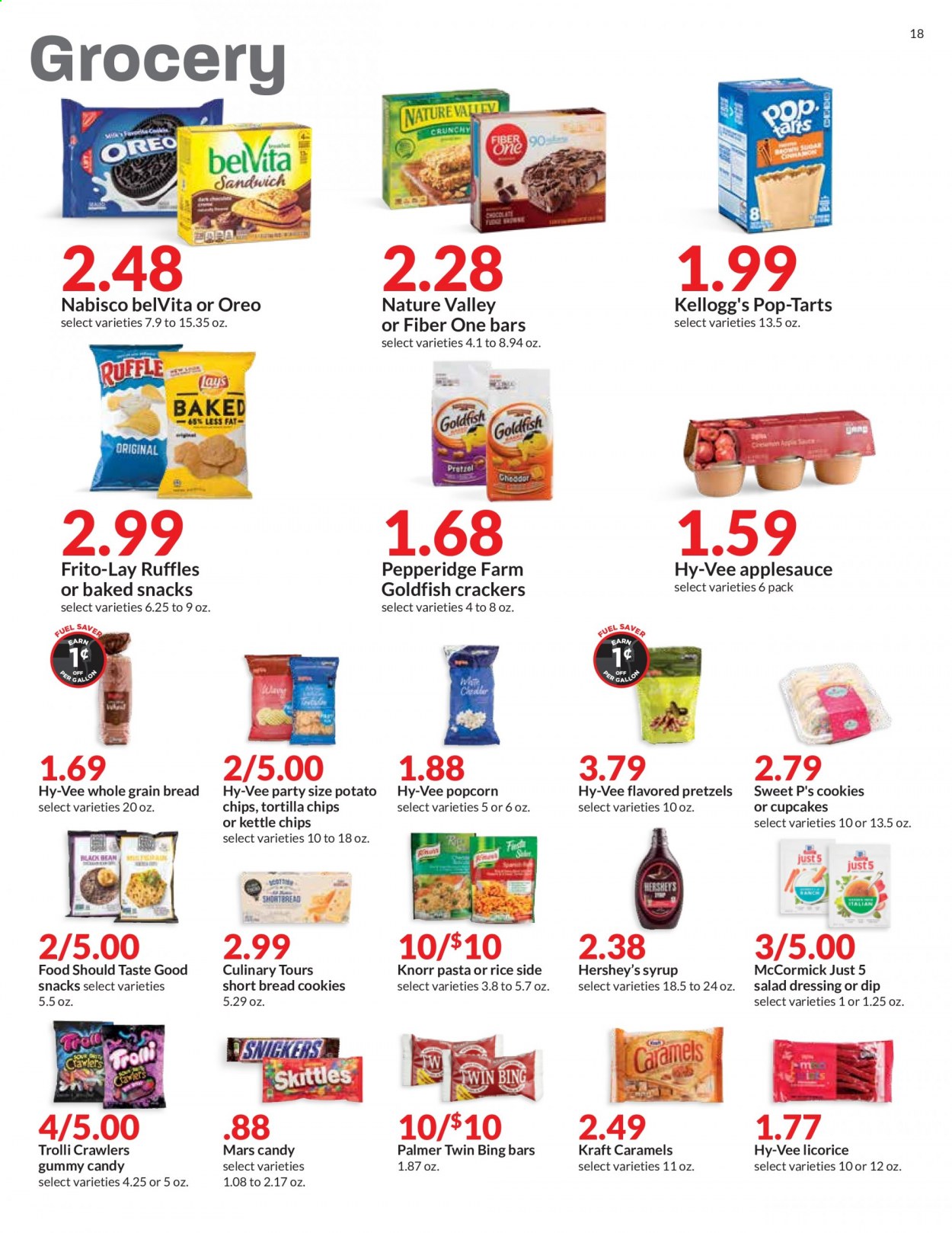thumbnail - Hy-Vee Flyer - 04/14/2021 - 04/20/2021 - Sales products - bread, pretzels, cupcake, sandwich, Knorr, Kraft®, Oreo, dip, Hershey's, cookies, snack, Trolli, Mars, crackers, Kellogg's, Skittles, Pop-Tarts, tortilla chips, potato chips, chips, Lay’s, popcorn, Goldfish, Frito-Lay, Ruffles, belVita, Nature Valley, Fiber One, rice, salad dressing, dressing, apple sauce, syrup. Page 18.