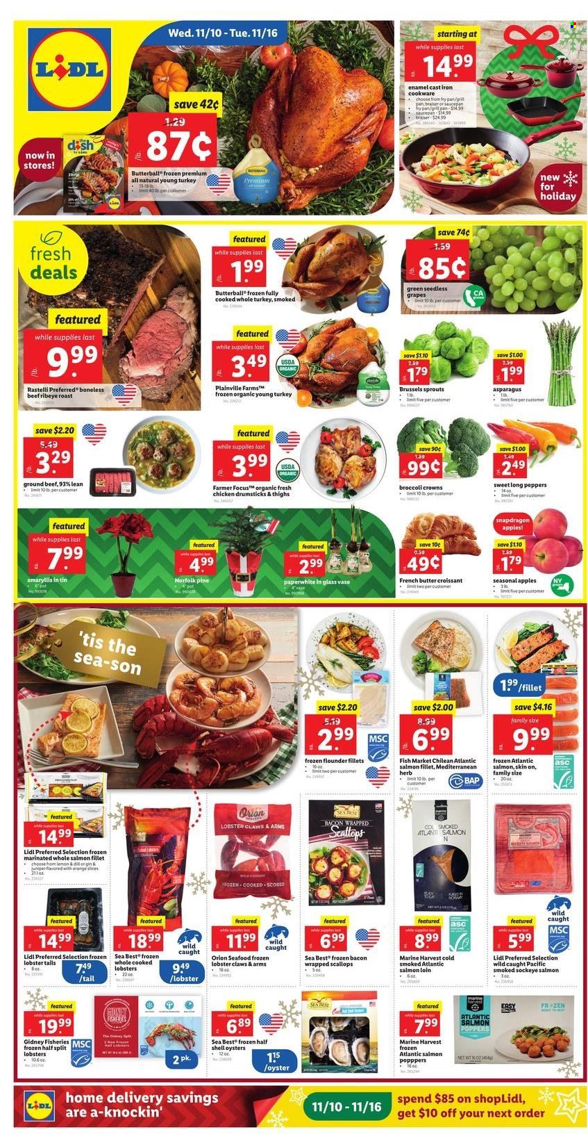 thumbnail - Lidl Flyer - 11/10/2021 - 11/16/2021 - Sales products - croissant, asparagus, peppers, brussel sprouts, apples, grapes, oranges, fish fillets, flounder, lobster, salmon, salmon fillet, scallops, oysters, seafood, lobster tail, bacon, Butterball, herbs, gin, whole turkey, chicken drumsticks, beef meat, ground beef, cookware set, pot, pan, saucepan, WD, vase, Shell. Page 1.