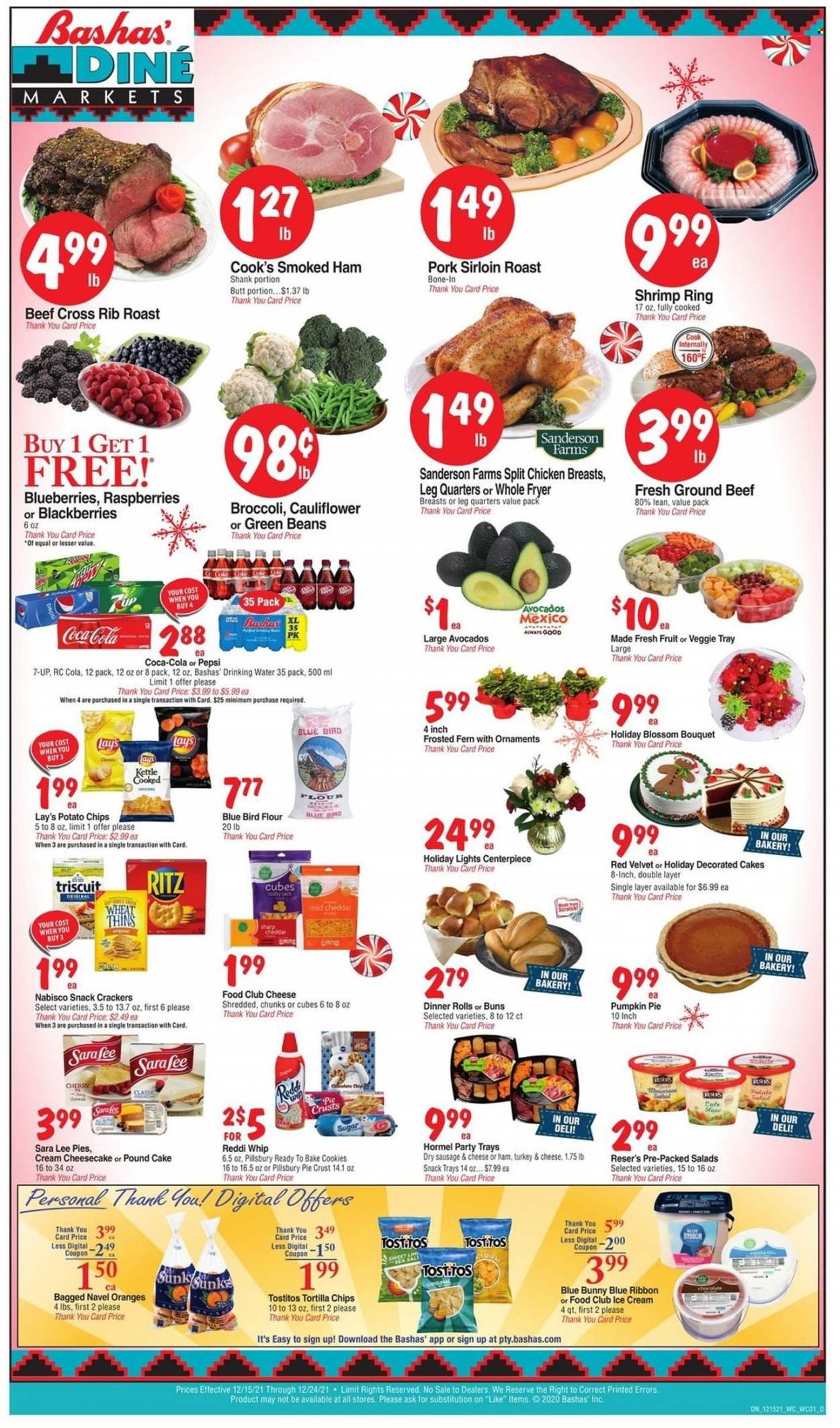 thumbnail - Bashas' Diné Markets Flyer - 12/15/2021 - 12/24/2021 - Sales products - cake, dinner rolls, buns, Sara Lee, pound cake, beans, broccoli, green beans, pumpkin, avocado, blackberries, blueberries, cherries, oranges, shrimps, Pillsbury, Hormel, ham shank, smoked ham, Cook's, sausage, Colby cheese, mild cheddar, Blossom, ice cream, cookies, snack, crackers, RITZ, tortilla chips, potato chips, chips, Lay’s, Thins, Tostitos, sugar, pie crust, Coca-Cola, Pepsi, 7UP, chicken breasts, beef meat, ground beef, pork loin, bouquet, navel oranges. Page 1.