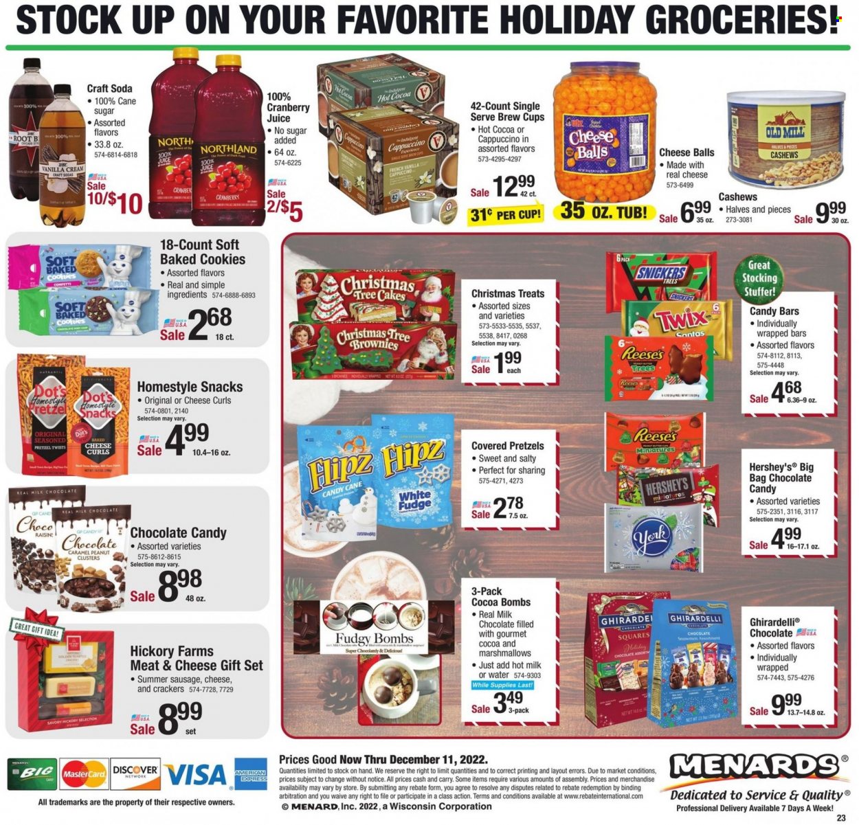 thumbnail - Menards Flyer - 11/29/2022 - 12/11/2022 - Sales products - pretzels, cake, brownies, sausage, summer sausage, cheddar, Reese's, Hershey's, cookies, fudge, gift set, marshmallows, milk chocolate, snack, candy cane, Snickers, Twix, crackers, Ghirardelli, chocolate candies, caramel, peanut butter, cashews, cranberry juice, juice, soda, hot cocoa, cappuccino, bag, cup, christmas tree. Page 26.