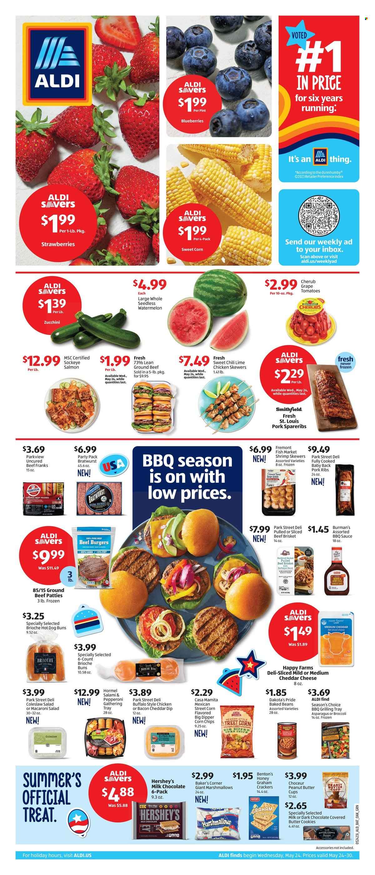 thumbnail - ALDI Flyer - 05/24/2023 - 05/30/2023 - Sales products - buns, brioche, asparagus, broccoli, tomatoes, zucchini, sweet corn, blueberries, strawberries, watermelon, salmon, shrimps, shrimp skewers, coleslaw, hamburger, sauce, beef burger, Hormel, brisket, salami, bratwurst, pepperoni, frankfurters, macaroni salad, sliced cheese, cheese, dip, Hershey's, frozen vegetables, cookies, graham crackers, marshmallows, milk chocolate, butter cookies, crackers, peanut butter cups, corn chips, cane sugar, baked beans, BBQ sauce, meat skewer, beef meat, ground beef, beef brisket, ribs, pork meat, pork ribs, pork spare ribs, pork back ribs, corn, chicken, mild cheddar, cheddar, snack, chips, beans, chocolate. Page 1.